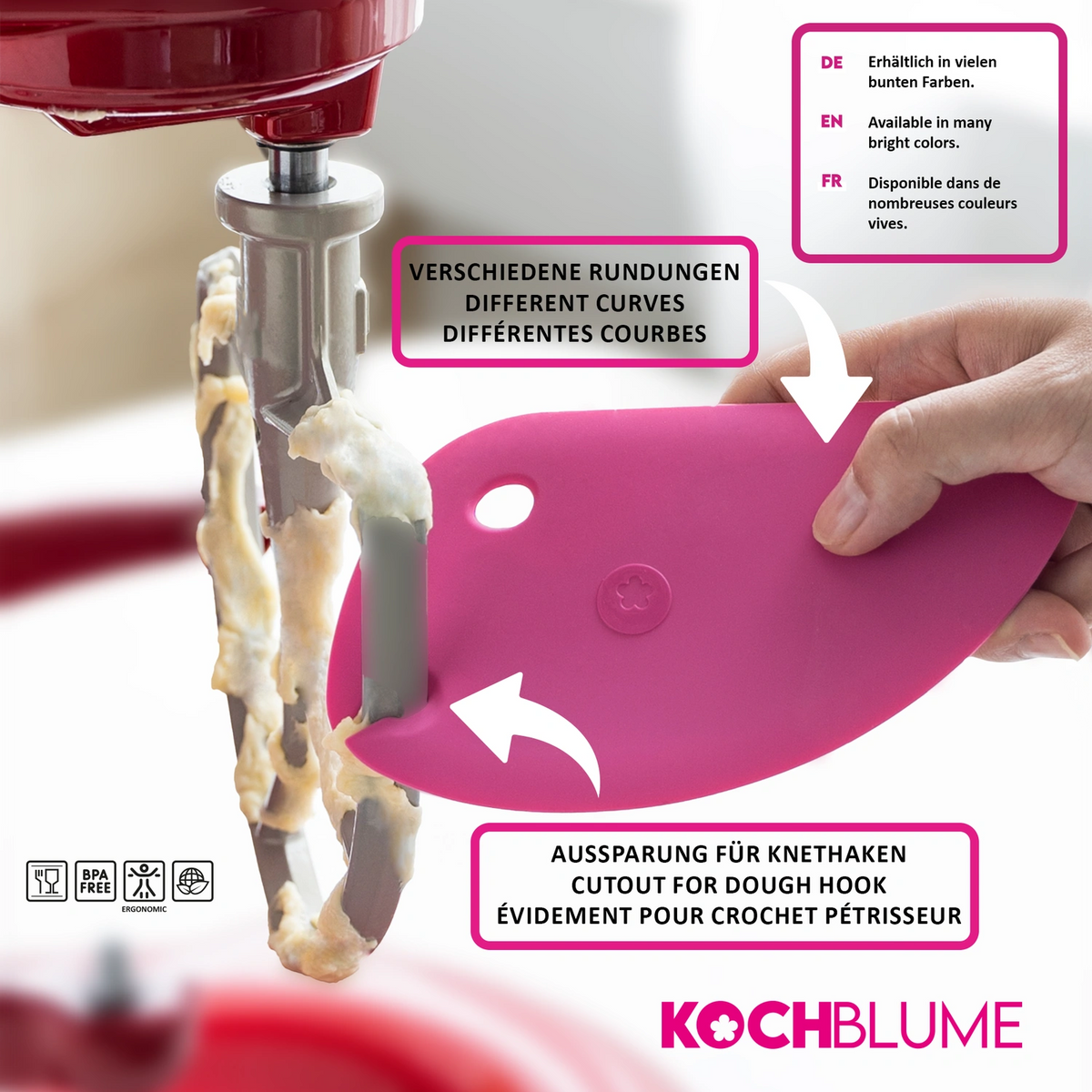 Eine rosa Teigkarte der Firma Kochblume GmbH dient zum Abkratzen von Teig vom Metallrührhaken eines Mixers; sie ist mit beschrifteten Merkmalen und mehrsprachigen Texten versehen, um die Identifizierung zu erleichtern.