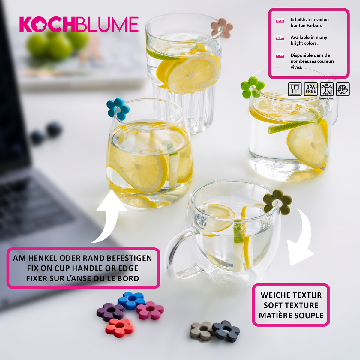 Drei Gläser und ein Becher, jeweils mit einem Glasmarkierer der Kochblume GmbH mit bunten Blumenmotiven am Rand, gefüllt mit Wasser, Zitrone und Minze.